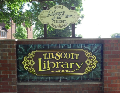 Outdoor T.B. Scott Free Library sign